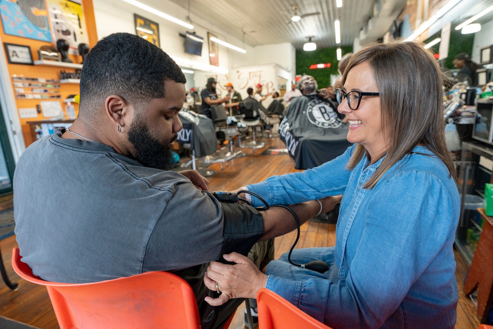How are barbershops promoting health education?