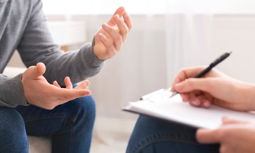 How can wellness programs improve mental health care for employees?