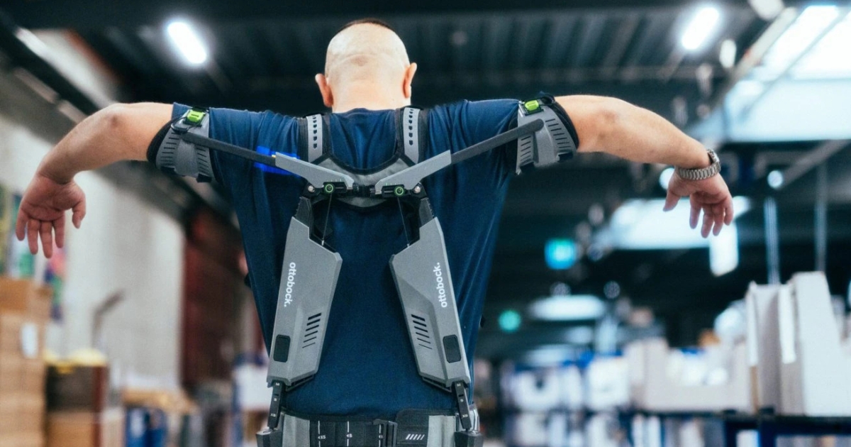 An exoskeleton being used by an IKEA employee to assist with lifting and reduce physical strain.